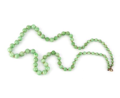 A jade bead necklace, comprising a single strand of jade beads, graduating from approximately 9.2mm to 4.9mm in diameter, the