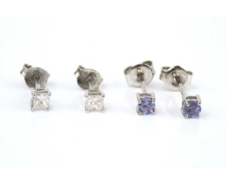 A pair of diamond single stone ear studs, each with a princess-cut diamond in claw setting, on post fittings, 18ct white gold