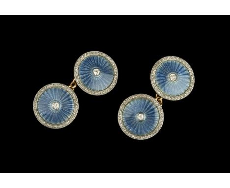 A pair of enamel and diamond cufflinks, each circular blue guilloché enamel panel centred with an old-cut diamond, bordered b