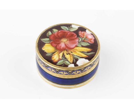 A 19th century French or Swiss gold and enamel circular vinaigrette, the cover decorated with a spray of flowers, and having 