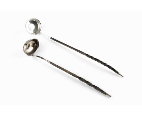 A Georgian silver toddy ladle, with coin inset bowl and whalebone twist handle, and another similar toddy ladle. (2)