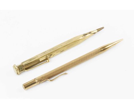 A nine carat gold propelling pencil, with engine turned decoration, stamped 9ct, 13cm long, and a gold plated Yard-o-Led penc