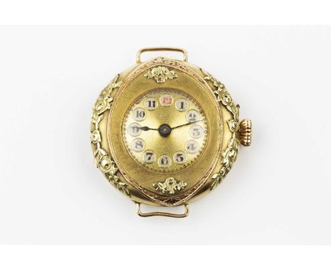 A lady's watch head, the circular gilt dial with Arabic numerals and radial decoration, to a manual movement, the two colour 