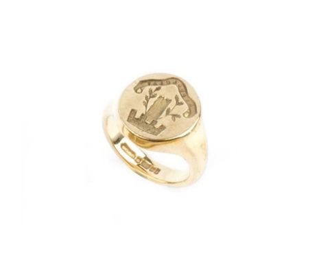 A 9ct gold signet ring, the oval panel incised with a crest below the motto 'REPULLULAT', Latin for 'It buds afresh', hallmar