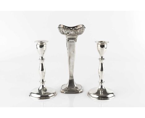 A pair of early 20th Century silver candlesticks, with simple knopped stems and weighted circular bases, by Lee &amp; Wigfull