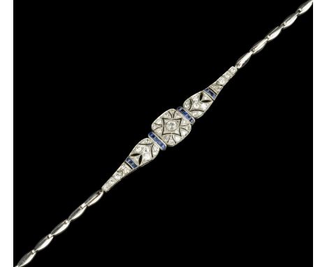 A sapphire and diamond panel bracelet, circa 1915-20, designed as a series of articulated pierced and millegrained panels of 