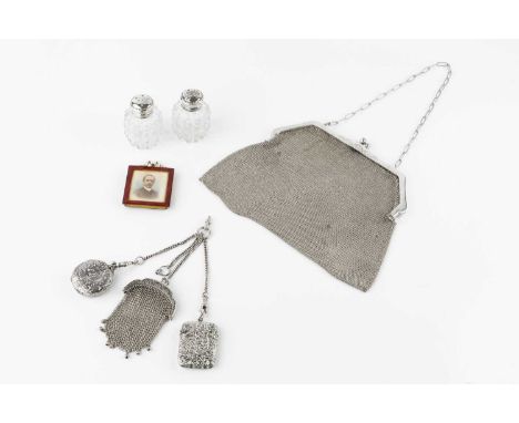 A late Victorian silver vesta case, embossed with foliage, by Lawrence Emanuel, Birmingham 1898, together with a white metal 