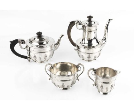 A late Victorian silver four piece tea and coffee service, of girdled design, relief decorated with panels of foliage and bel