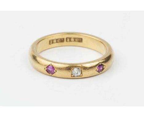 A ruby and diamond set band ring, the court section band inset with an old-cut diamond between two circular mixed-cut rubies,