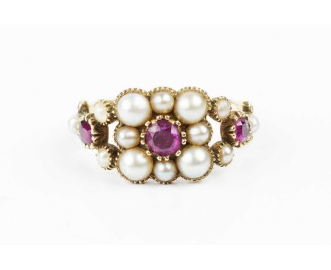 A 19th century ruby and half pearl panel ring, designed as a cluster of half pearls, enclosing a cushion-shaped ruby in foile