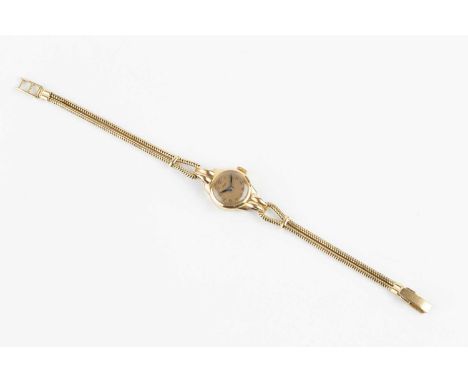 A lady's bracelet watch by Piaget, the circular gilt dial with Arabic numerals, to a jewelled manual movement, the case with 