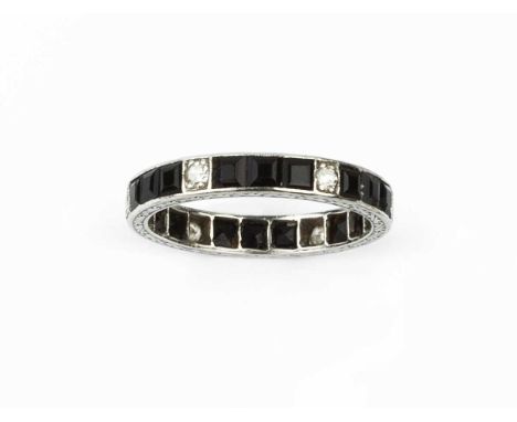 A diamond and gem set full hoop eternity ring, alternately set with single-cut diamonds and trios of square step-cut black on