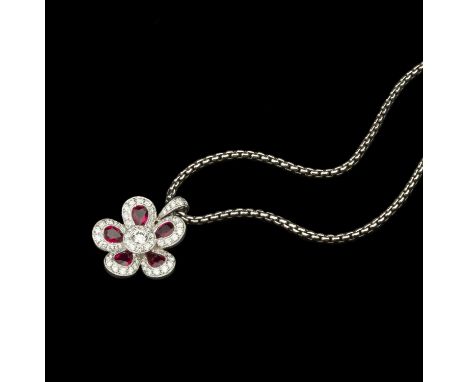 A ruby and diamond cluster pendant on chain, the pendant designed as a flowerhead cluster of millegrain set pear-shaped mixed