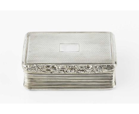 A George III silver gilt rectangular box, with engine turned top and base, reeded slightly concave sides, and foliate cast th