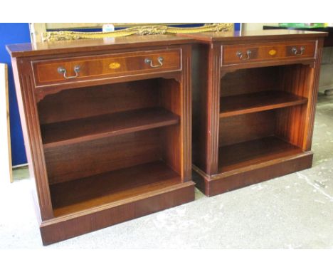 BOOKCASES, a pair, Sheraton style mahogany and inlaid each with drawer above an open shelf, 82cm H x 76cm x 36cm. (2)