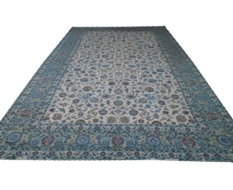 LARGE KASHAN CARPET, 530cm x 310cm, all over scrolling vines and palmettes design on an ivory field inside a repeat palmette 