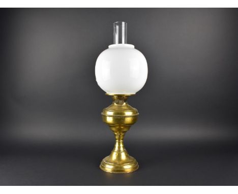 A Brass Oil Lamp with Unrelated Opaque Glass Shade and Unrelated Chimney 