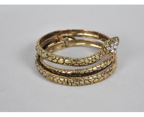 A Jewelled Gilt Metal Jewelled Bangle in the Form of a Coiled Snake 