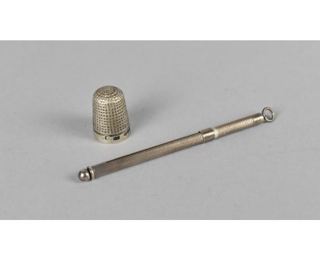 A Silver Swizzle Stick Together with a Silver Thimble 