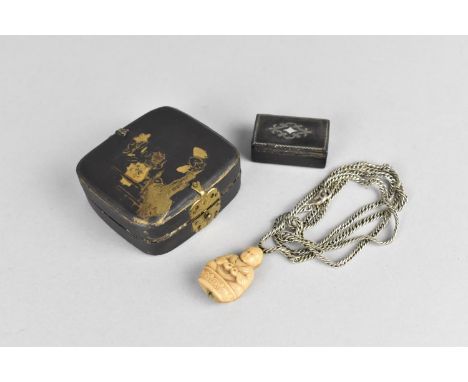 A Small Chinese Papier Mache Box decorated with Mushrooms and Flowers Containing Small Jade Buddha on Silver Chain and Tiny S