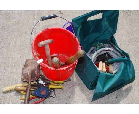 A plastic bucket, garden tools, tin snips, etc.