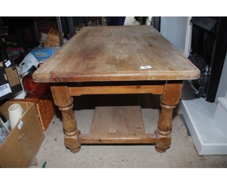 A large pine coffee table with lower shelf, 24'' x 18 1/2'' x 42''.