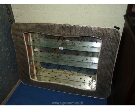 A retro illuminated drinks shelf unit with wall mounts.