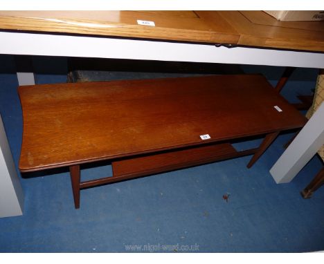 A dark wood coffee table with lower shelf.