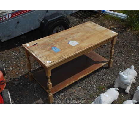 A coffee table with lower shelf, 38" x 18" x 19" high.