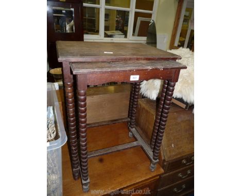 A nest of two Oak tables with bobbin turned legs.