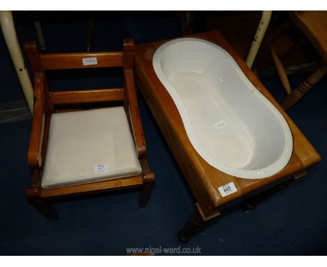 A child's commode chair and baby bath.