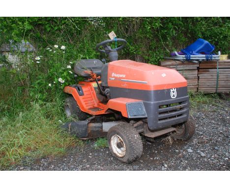 A Husqvarna 4 speed LT100 ride-on lawn mower, 10 HP Briggs &amp; Stratton engine, sold as seen.