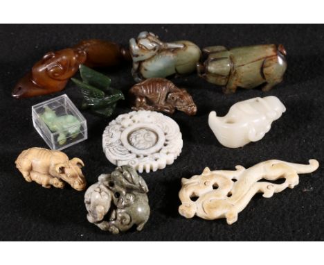 A group of 20th century Chinese jade agate and other carvings including a group of three playful puppies mostly depicting ani