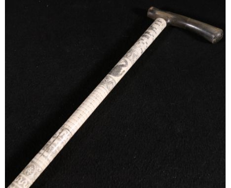 Bone and horn "diviner's" walking stick with inked incised detail, script and animals, 89cm