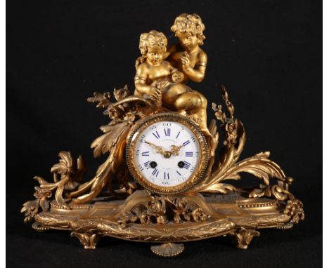 19th century French ormolu mantel clock, maker T A Simpson & Cie, Paris, the enamel dial with blue Roman/Arabic numerals, the