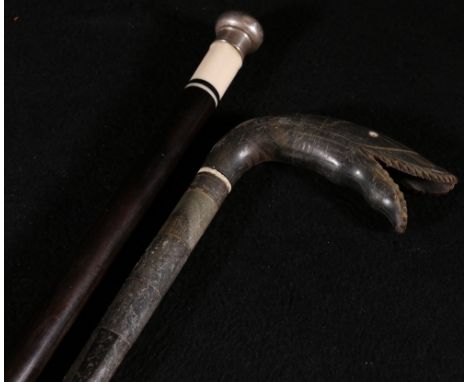 Sectional horn walking stick, the handle carved as a serpent head, 88cm another early 20th century cane in ebony with ivory t