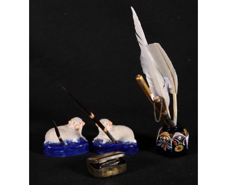 Pair of Staffordshire pottery quill holders in the form of sheep with textured bodies, Bristol blue glass inkwell of hexagona