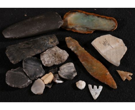 Group of arrowheads, pottery fragments and stone tools collected in England and Scotland.