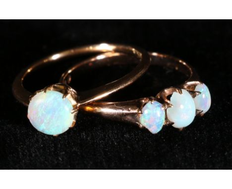 Opal three stone ring in gold, probably '10K' and another.