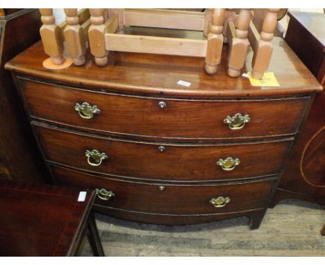 A 19th Century mahogany bow front chest of three drawers on bracket feet