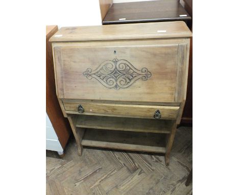 A reproduction oak and leaded light cabinet and a satinwood secretaire