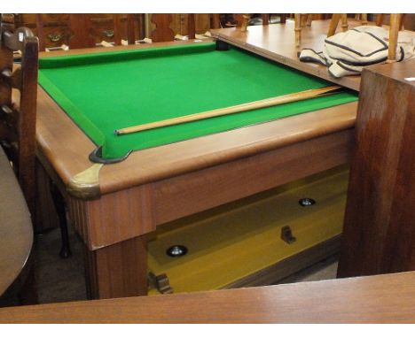 A pool table which converts to a dining table overhead lighting and accessories