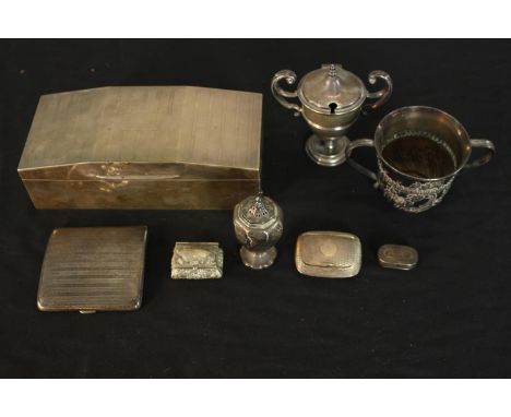 A collection of silver items, including a cedar lined engine decorated cigarette box, a Georgian repousse twin handled cup, u