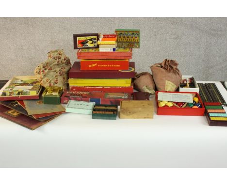 A large collection of vintage boards games and jigsaws, including Halma, Draughts, Scoop, Pegity, Clock Golf, Scrabble and bl