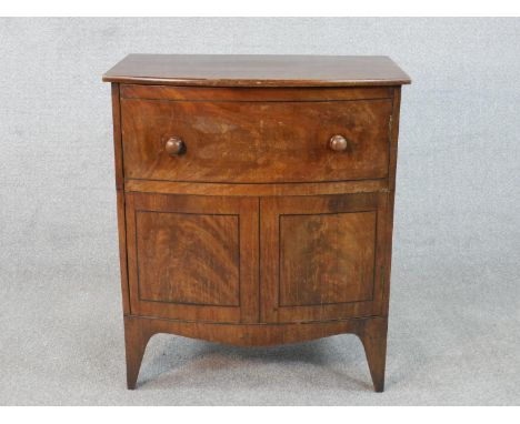 A Georgian mahogany bow fronted commode cabinet with faux draw on swept bracket feet. H.70 W.60 D.40cm 