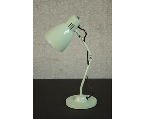 A pale green enamel retro mstyled anglepoise style desk lamp on a circular base. H.44 Dia.14cm. 