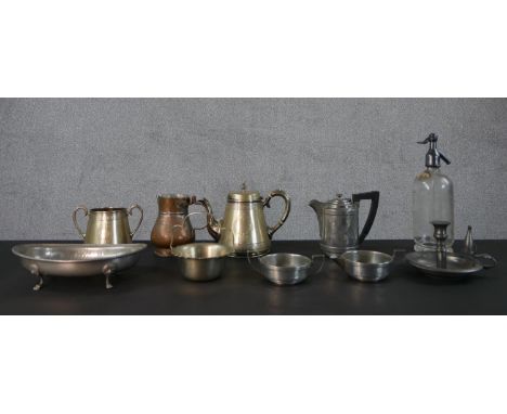 A collection of metal ware, including a vintage soda siphon, a silver plated engraved tea set, a copper measure and pewter it