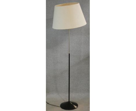 A 1960's vintage standard lamp in black metal and chrome. H.145cm 