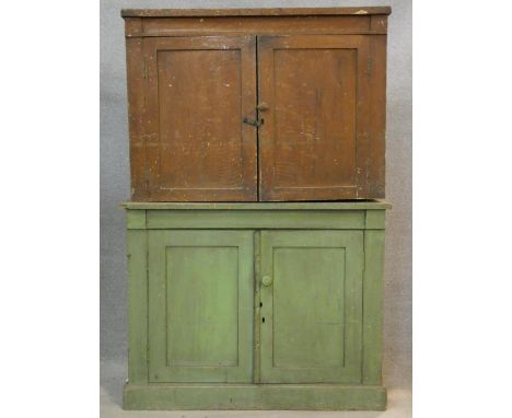 A 19th century painted pine two section bookcase with panel doors to upper and lower sections on plinth base. H.144 W.97 D.37