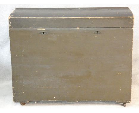 A 19th century domed top travelling trunk on casters. H.88 L.107 W.60cm